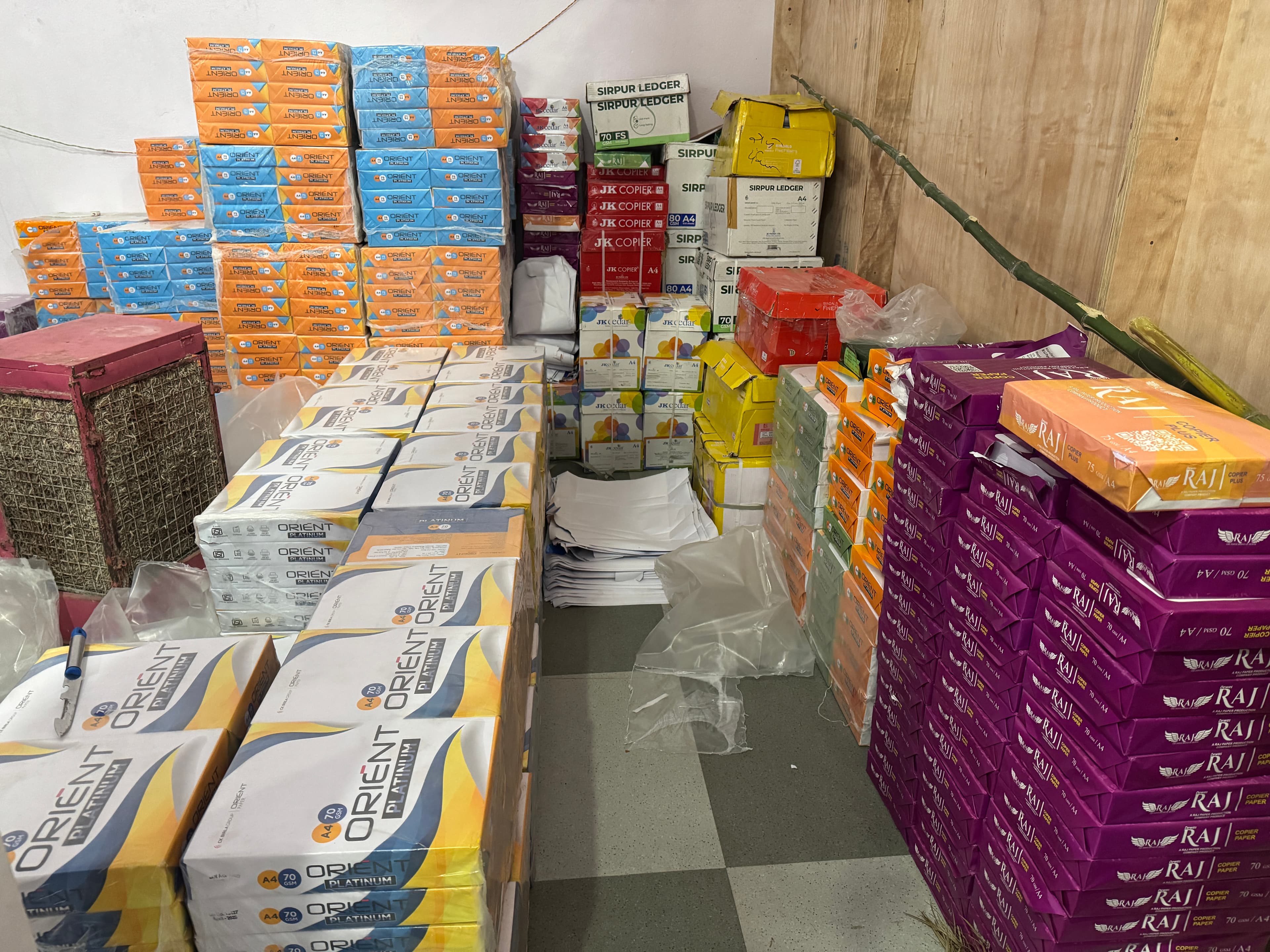 Dealer stockroom holding Dewas Raj cartons alongside other partner stationery brands