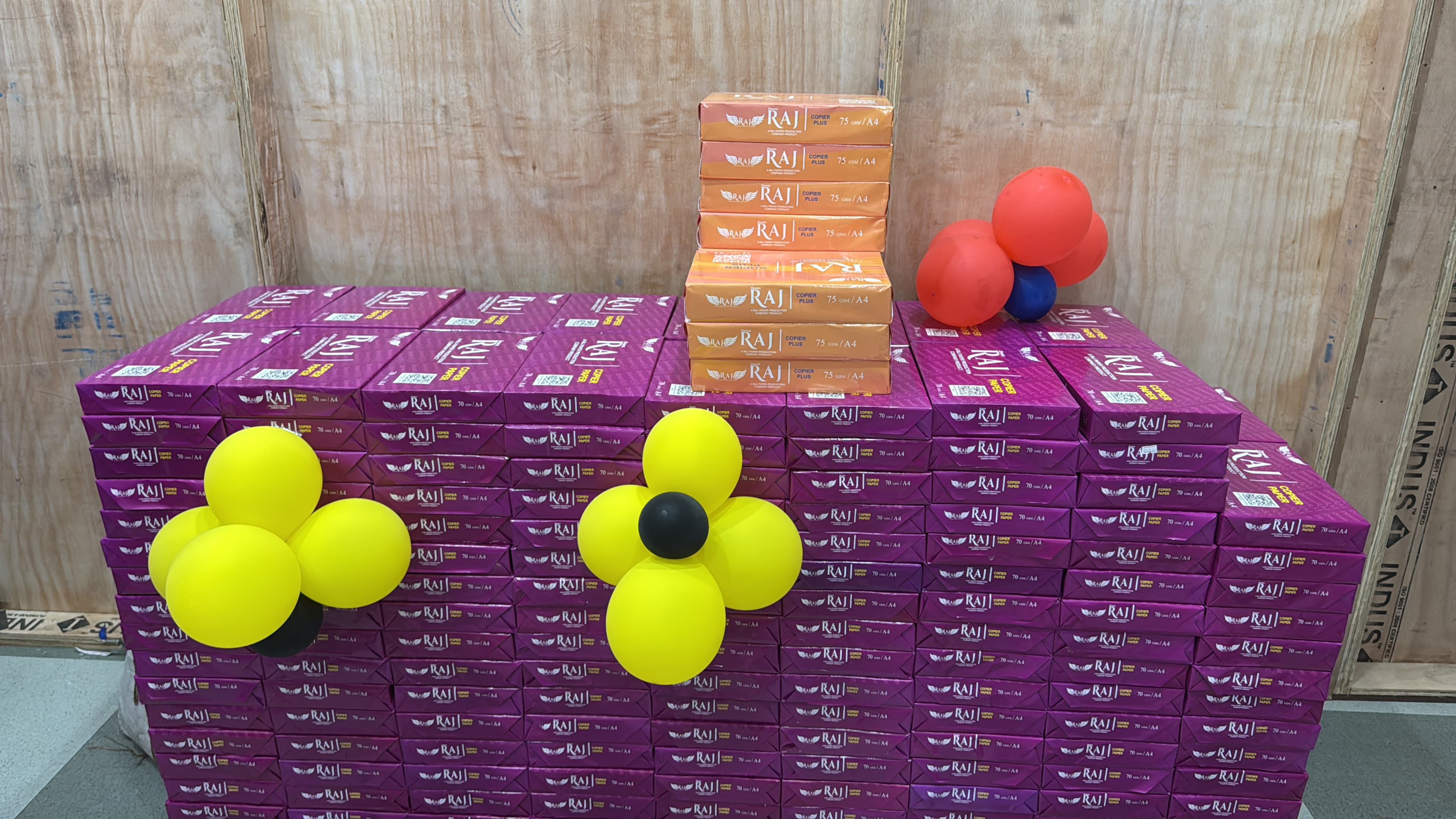 Festive Dewas Raj copier paper carton display with balloon decoration